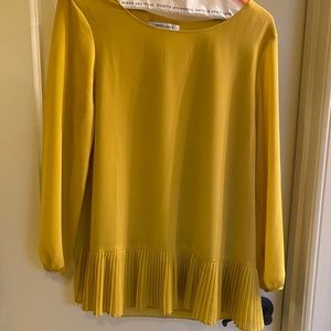 Naked zebra mustard top with pleat detail at edge